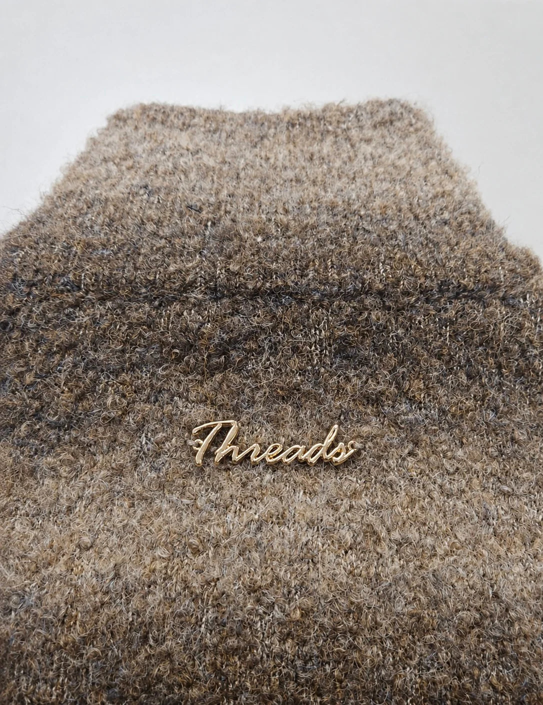 Threads Collective knitwear fabrication detail